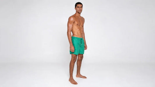 Athletic Model in Green Swim Shorts
